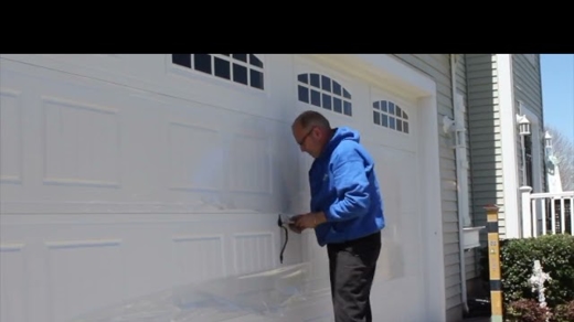 man fixing garage door