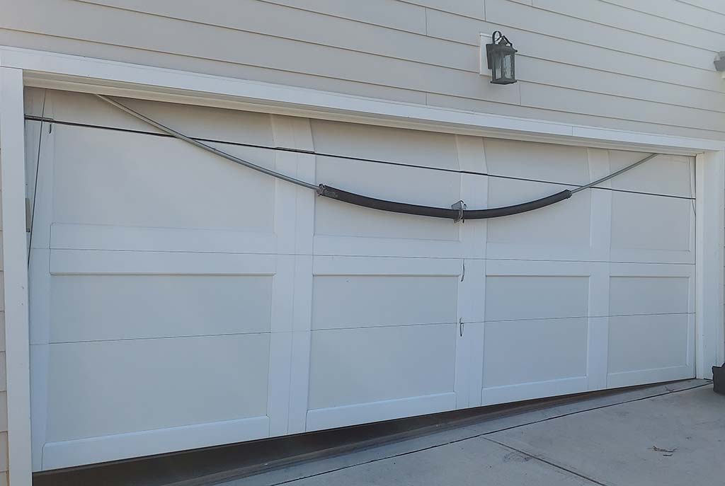 sagging garage door panel